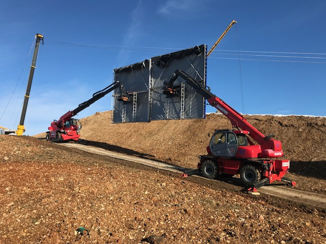 Manitou used for lifting green screen on film set